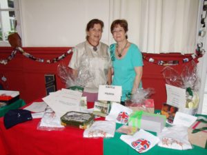 Mary Crawshaw, BCS Chair 2010, and Jane Anderson at the BCS 2010 Christmas raffle prize display, Rio de Janeiro, Brazil, News